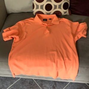 Orange Izod polo short sleeve shirt